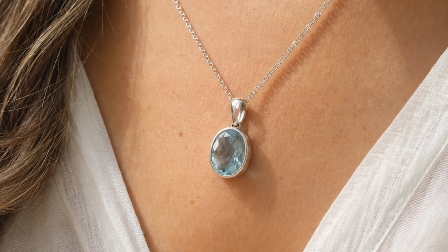 Aquamarine pendant worn for calm communication