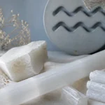 Aquarius December 2026 monthly horoscope with Selenite as crystal of the month, zodiac symbol ♒