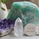 Aquarius and Pisces compatibility with Amazonite, Amethyst, and Quartz crystals arranged with zodiac symbols ♒ and ♓