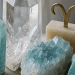 Aries and Aquarius compatibility with Aquamarine, Amazonite, and Quartz crystals arranged with zodiac symbols ♈ and ♒