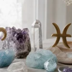 Aries and Pisces compatibility with Aquamarine, Amethyst, and Quartz crystals arranged with zodiac symbols ♈ and ♓