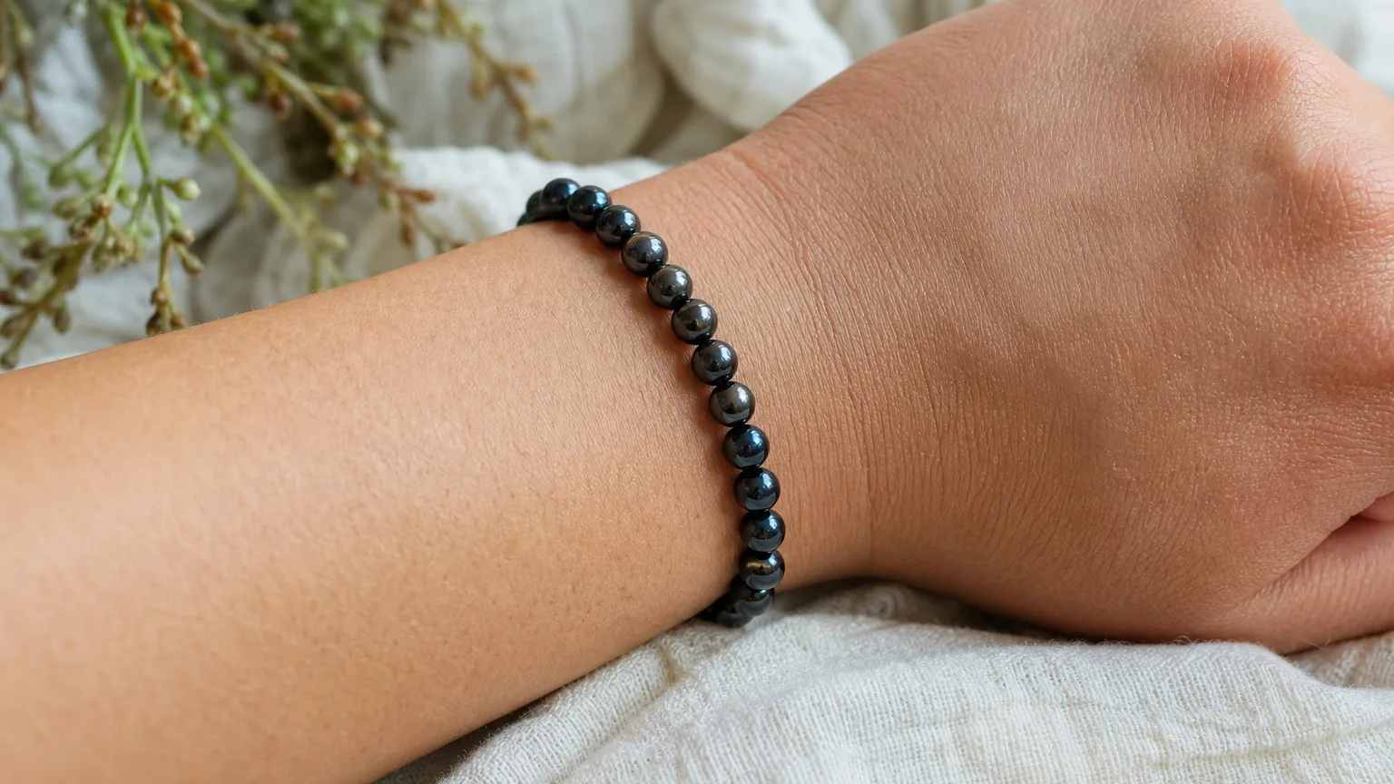 Black Pearl Meaning: Healing Properties & Uses 5 Black pearl bracelet worn on the wrist for daily calm