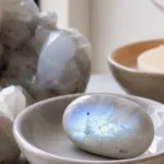 Cancer March 2026 monthly horoscope with Moonstone as crystal of the month, zodiac symbol ♋