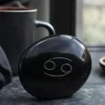 Cancer November 2026 monthly horoscope with Obsidian as crystal of the month, zodiac symbol ♋