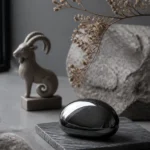 Capricorn January 2026 monthly horoscope with Hematite as crystal of the month, zodiac symbol ♑