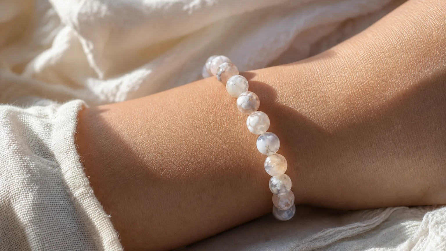 Cloud Agate Meaning: Healing Properties & Uses 5 Cloud agate bead bracelet worn on the wrist for daily use