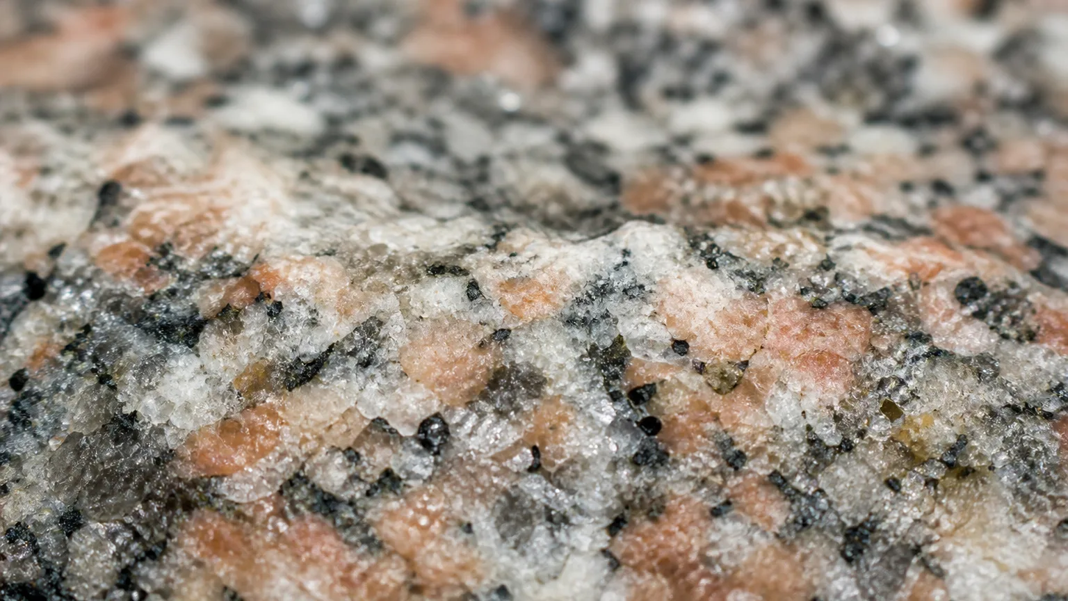 Speckled granite quartz feldspar mica grain close-up