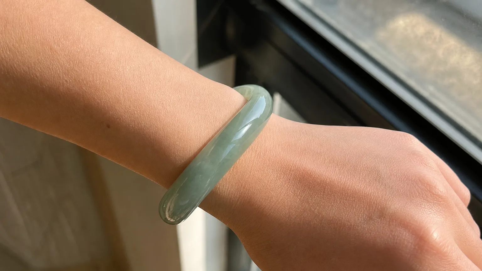 Jadeite bangle worn on the wrist for harmony