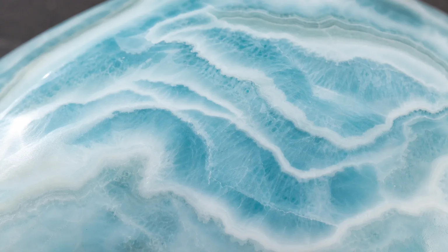 Larimar Meaning: Healing Properties & Uses 2 Larimar blue and white wave pattern pectolite close-up