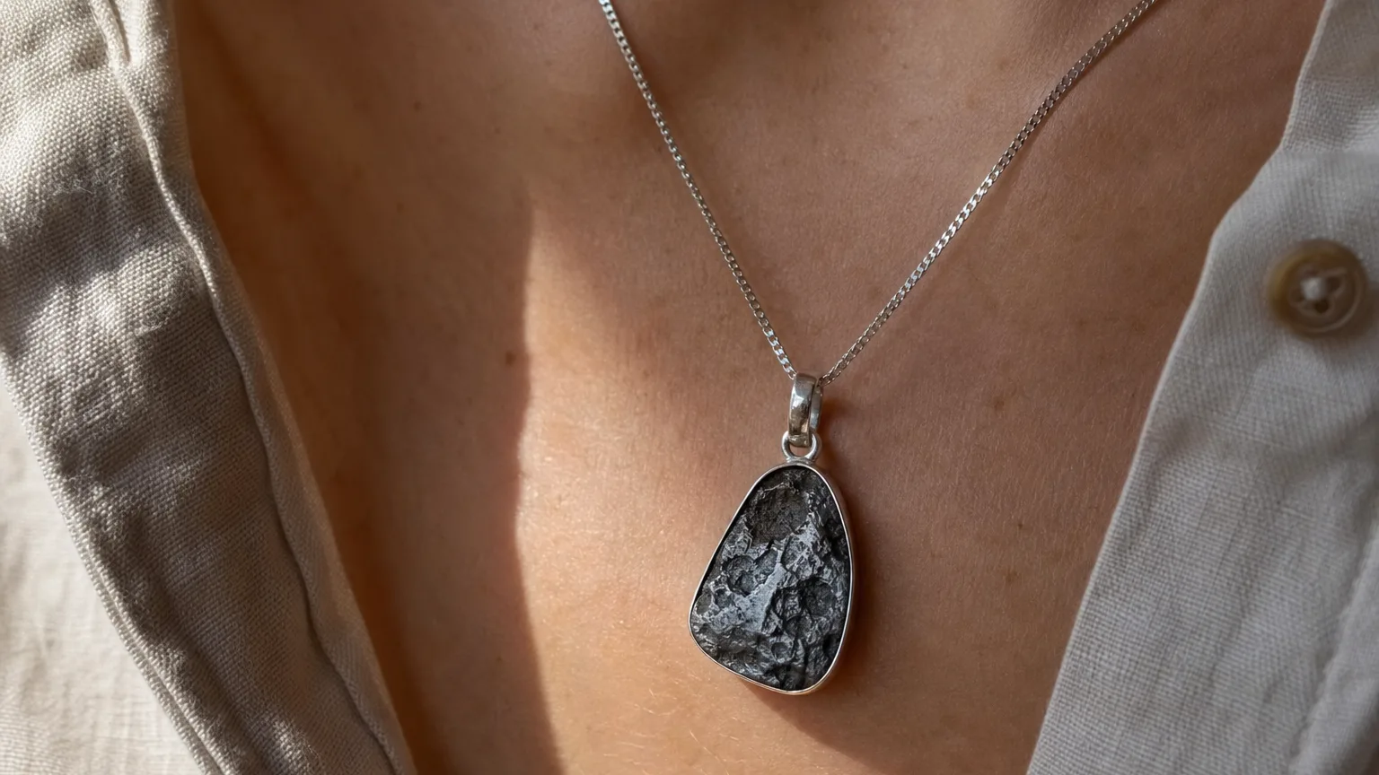 Meteorite Meaning: Healing Properties & Uses 5 Meteorite pendant worn for daily perspective
