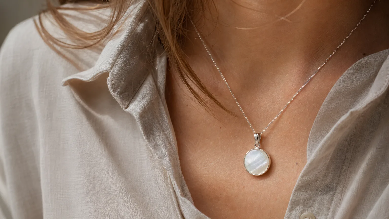 Nacre pendant worn for calm and reflection