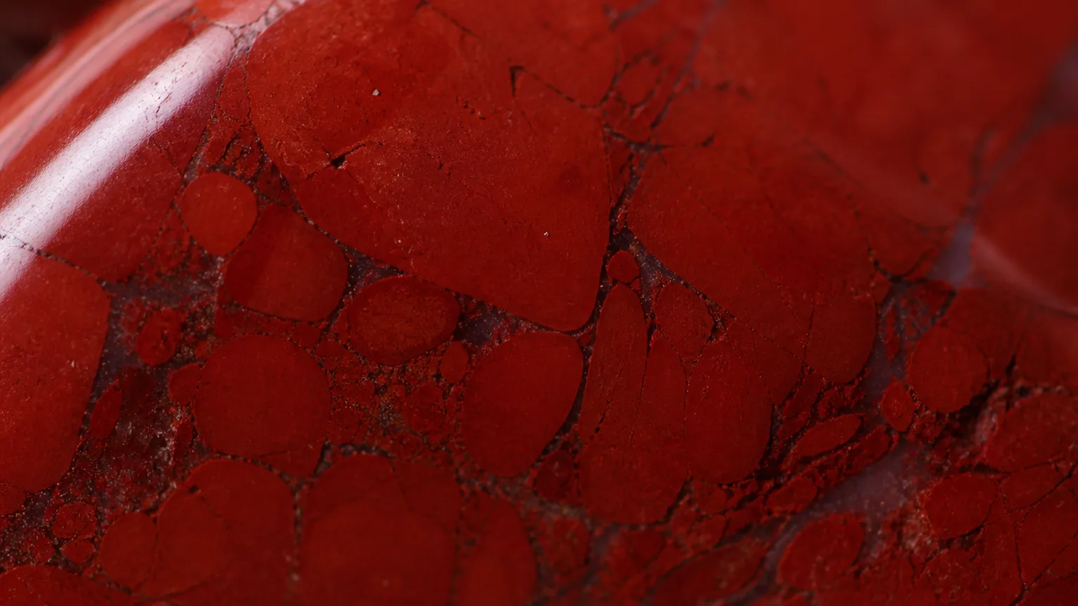 Red Jasper Meaning: Healing Properties & Uses 2 Deep red Red Jasper color and texture close-up