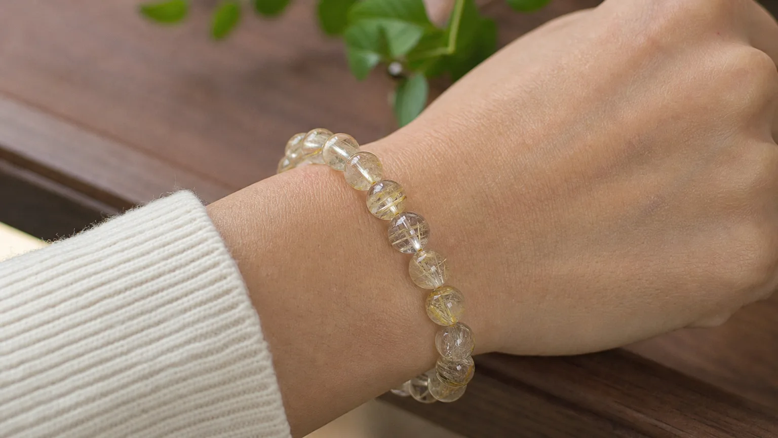 Rutilated quartz bracelet worn on the wrist for daily use