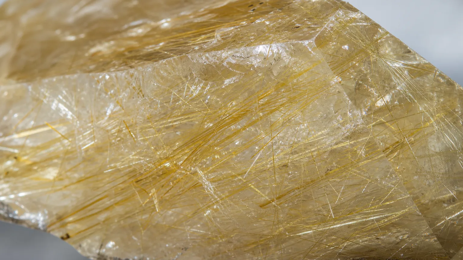 Rutilated quartz golden rutile needle inclusions close-up