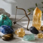 Best crystals for Sagittarius: Turquoise, Citrine, Sodalite, Tiger's Eye and more arranged with a Sagittarius archer motif