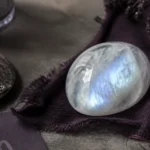 Scorpio June 2026 monthly horoscope with Moonstone as crystal of the month, zodiac symbol ♏