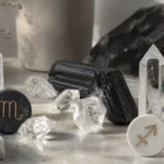 Scorpio and Sagittarius compatibility with Black Tourmaline, Herkimer Diamond, and Quartz crystals arranged with zodiac symbols ♏ and ♐