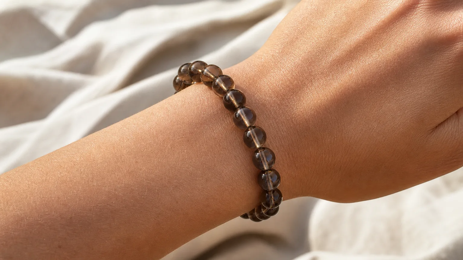 Smoky quartz bracelet worn on the wrist for grounding