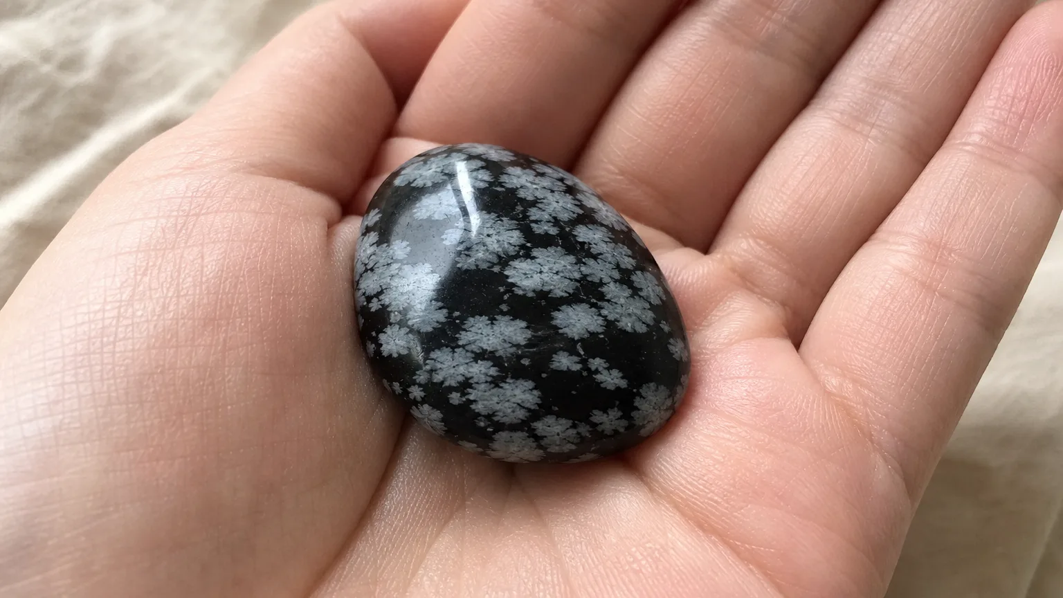 Snowflake obsidian tumbled palm stone for balance