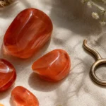 Taurus August 2026 monthly horoscope with Carnelian as crystal of the month, zodiac symbol ♉