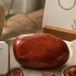 Taurus September 2026 monthly horoscope with Red Jasper as crystal of the month, zodiac symbol ♉
