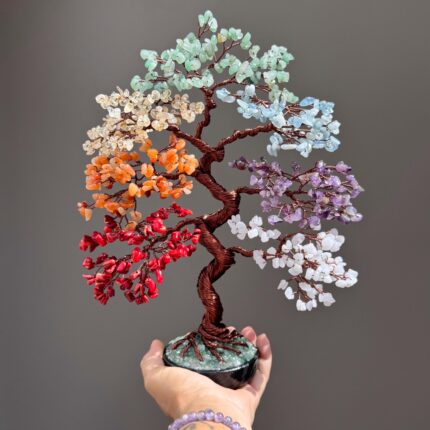May include: A decorative tree sculpture featuring a twisted dark brown wire trunk and branches adorned with clusters of multi-colored gemstone chips in shades of red, orange, yellow, light green, light blue, purple, and white, set in a black base.